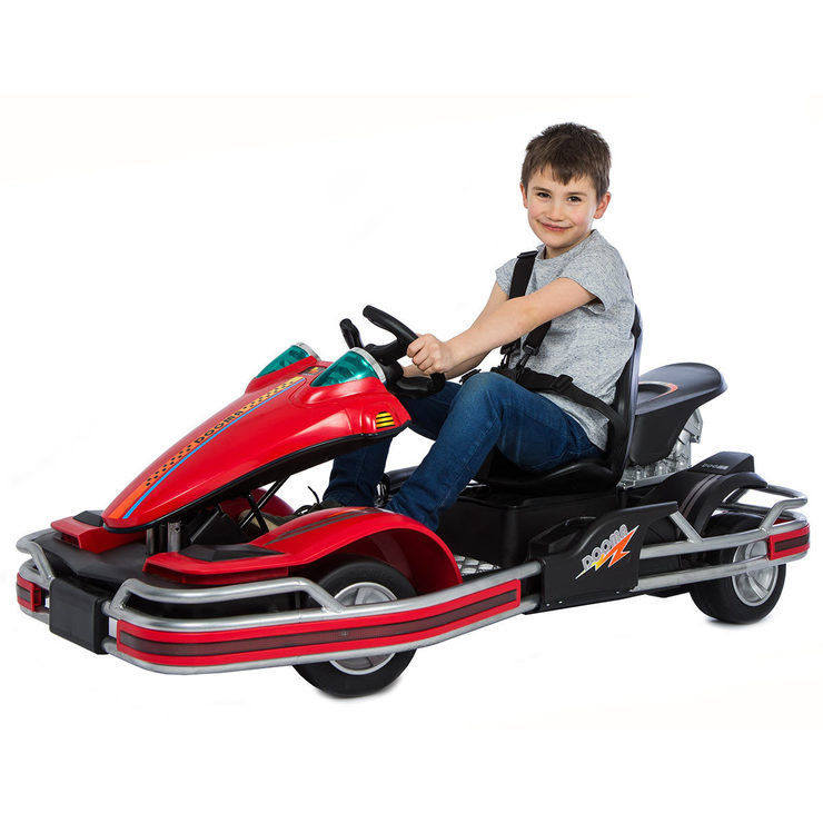 a boy kid riding in a go kart