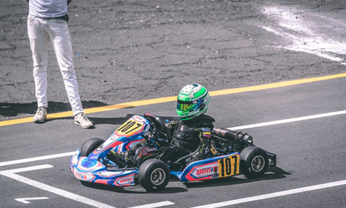 Photo of a person riding a go kart